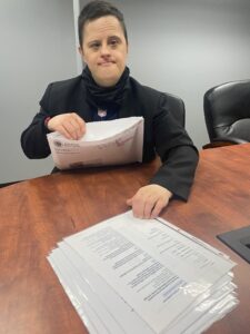 Carl with some paperwork at a desk